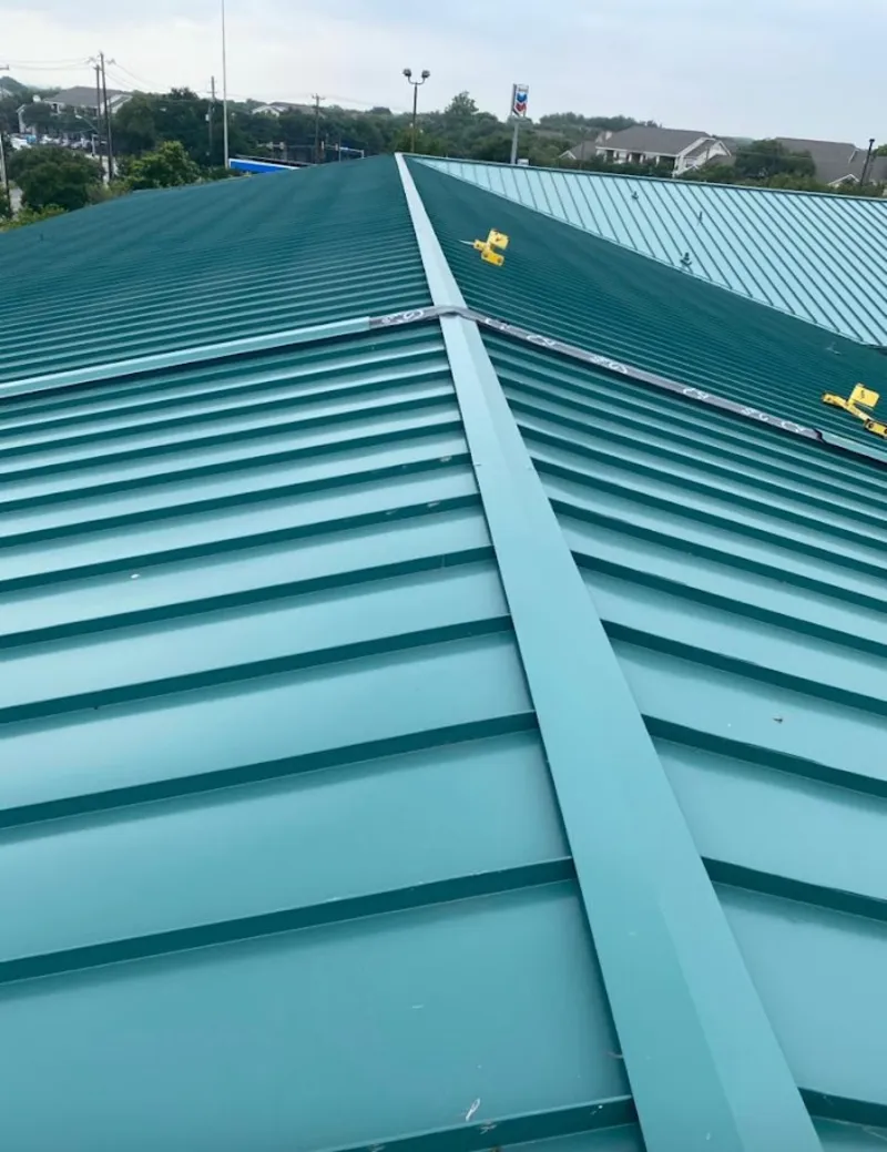 Green commercial metal roof ridge and valley for Metal Roof Repair in Flower Hill